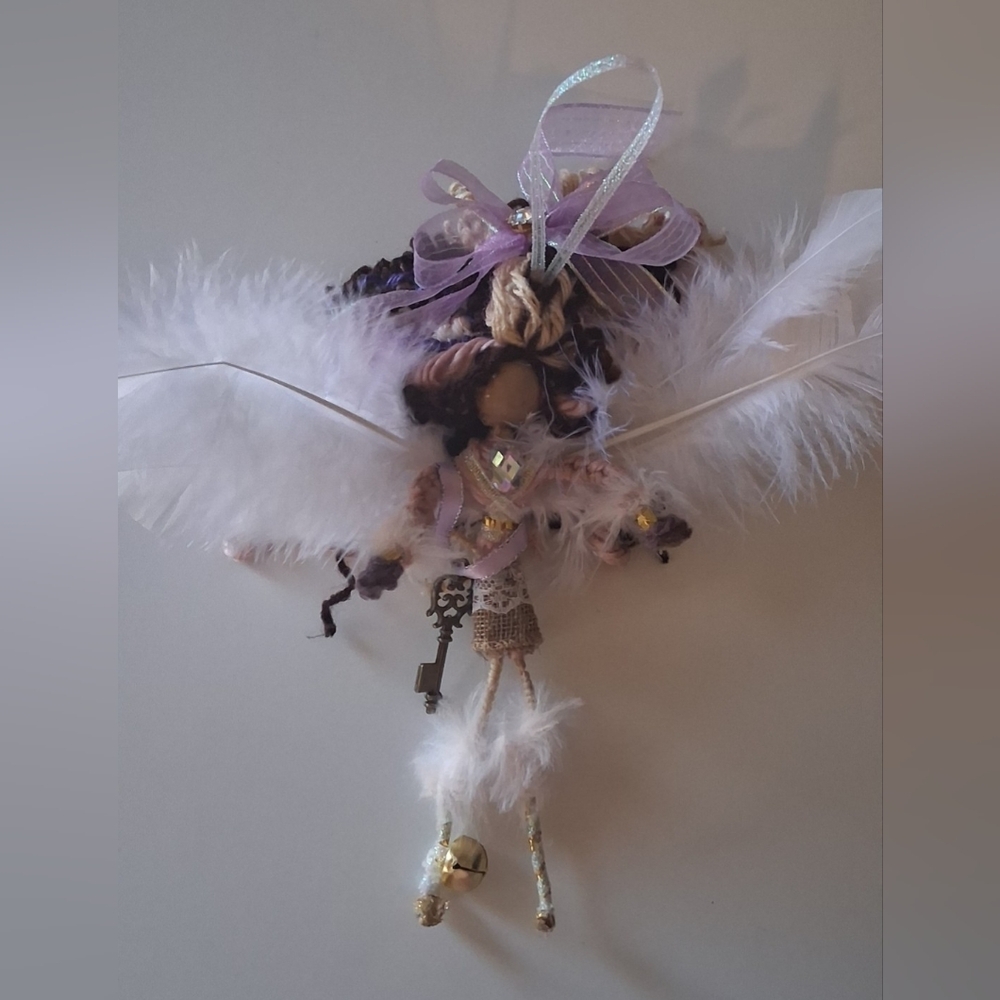 *(Handcrafted Angel Ornament Doll with Feathers and Key.)*
